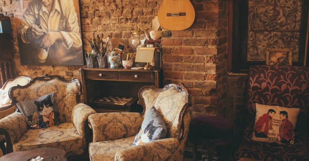 Warm vintage room with armchairs, guitar, and artwork on a brick wall, creating a cozy atmosphere.