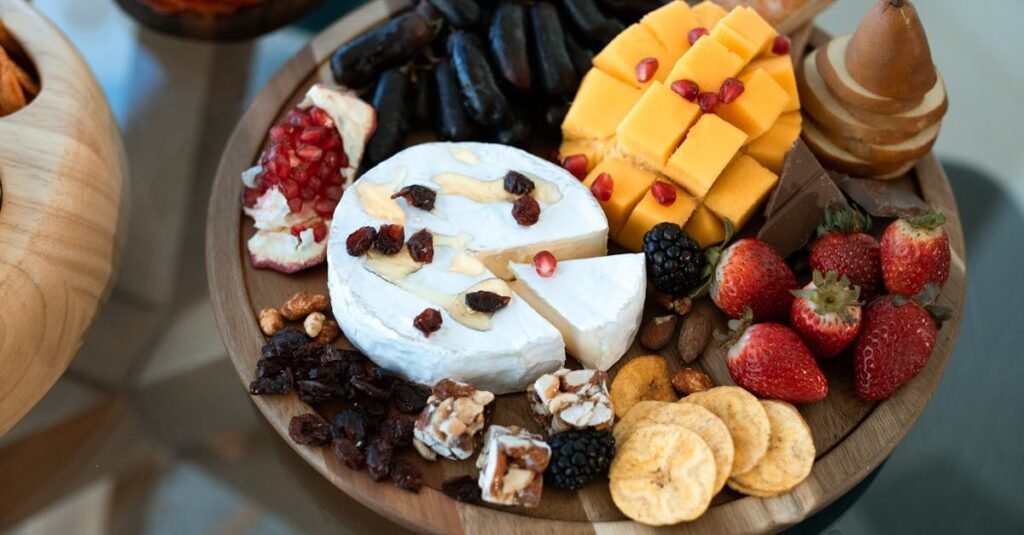 Elegant charcuterie board with cheese, fruits, and nuts, perfect for entertaining.
